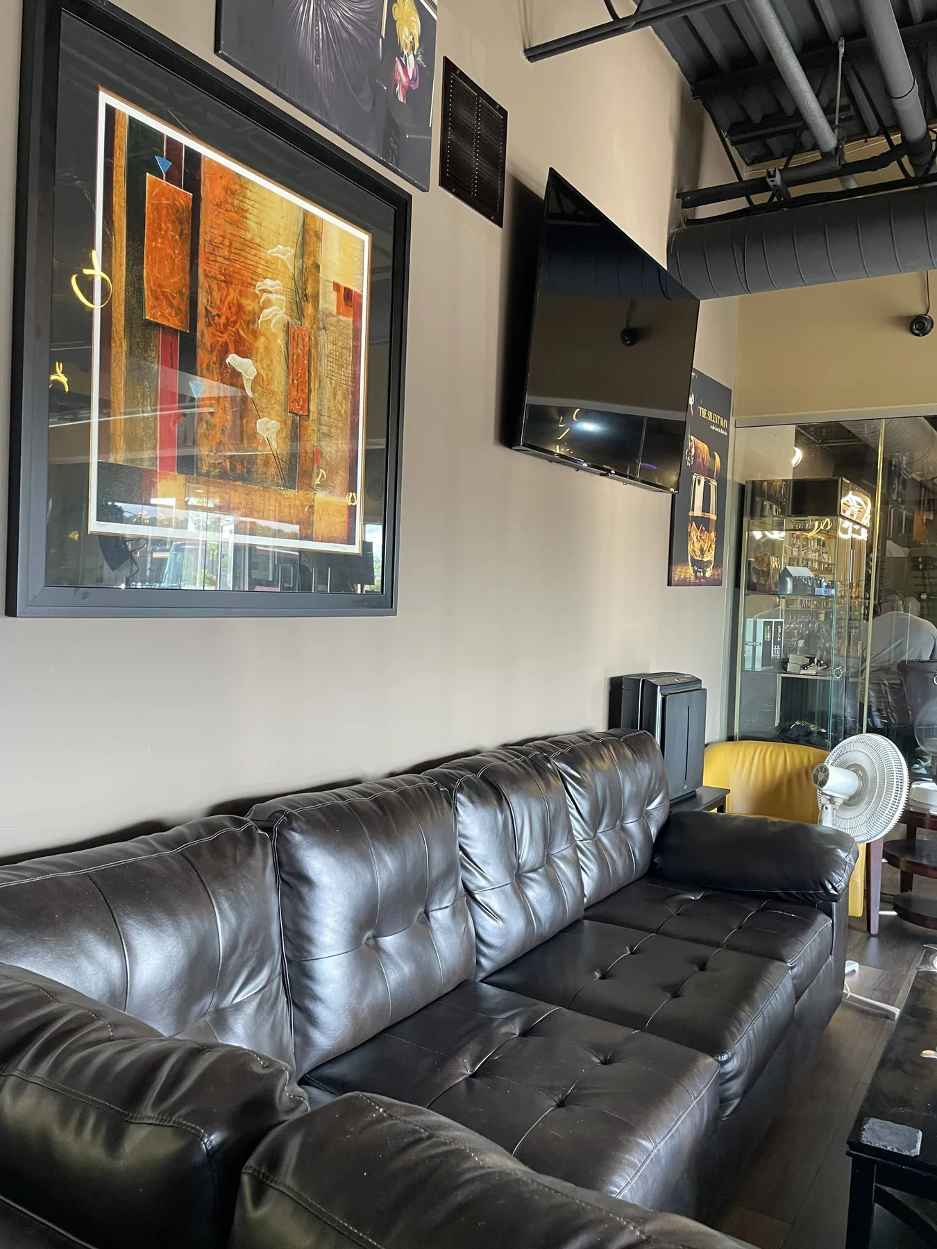 Leather sofa seating inside Exotic Blends Cigar Lounge